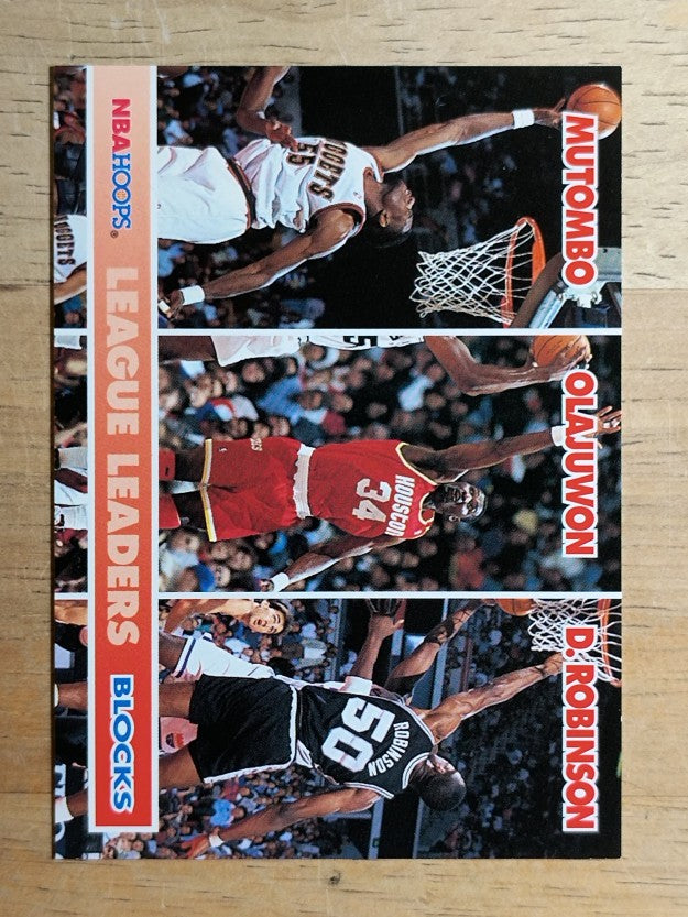 1994-95 Hoops #254 Dikembe Mutombo LL/Hakeem Olajuwon/David Robinson