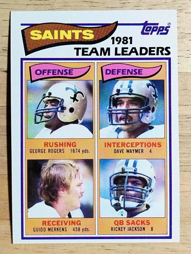 1982 Topps #404 Saints TL/George Rogers/Guido Merkens/Dave Waymer/Rickey Jackson