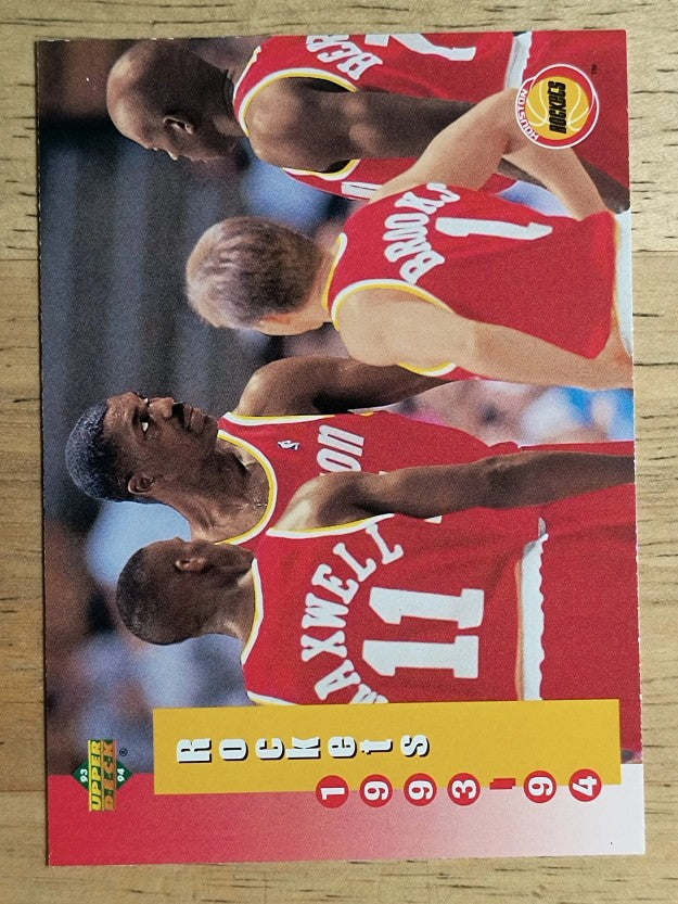 1993-94 Upper Deck #219 Houston Rockets Sked/Hakeem Olajuwon (NM)