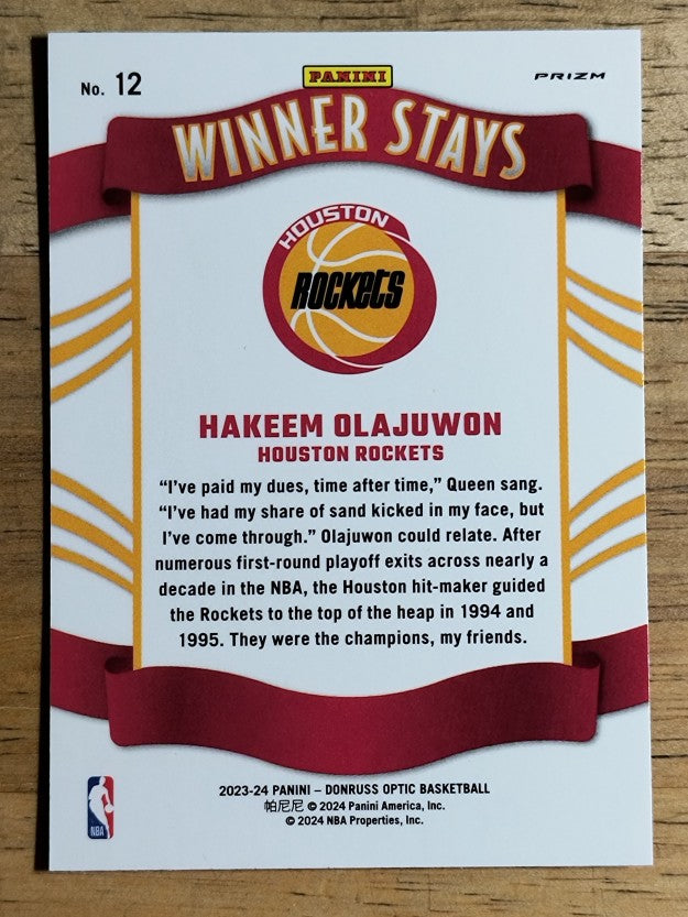 2023-24 Donruss Optic Winner Stays Holo #12 Hakeem Olajuwon
