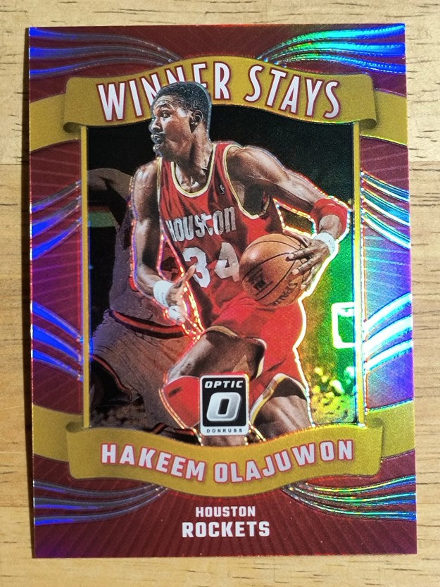 2023-24 Donruss Optic Winner Stays Holo #12 Hakeem Olajuwon