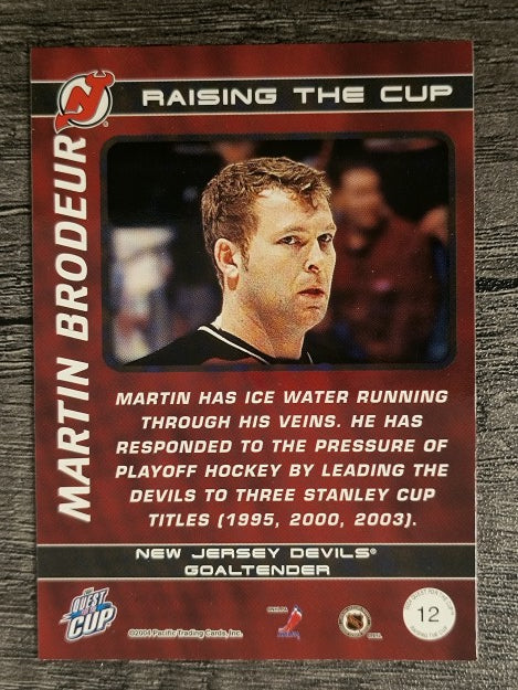 2003-04 Pacific Quest for the Cup Raising the Cup #12 Martin Brodeur