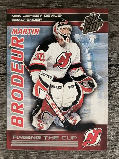 2003-04 Pacific Quest for the Cup Raising the Cup #12 Martin Brodeur