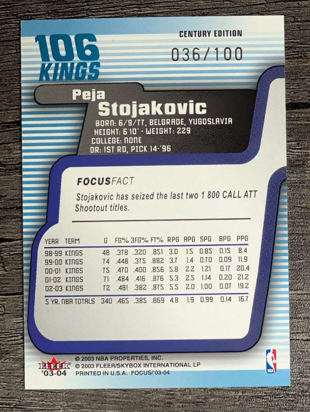 2003-04 Fleer Focus Numbers Century #106 Peja Stojakovic (EX)