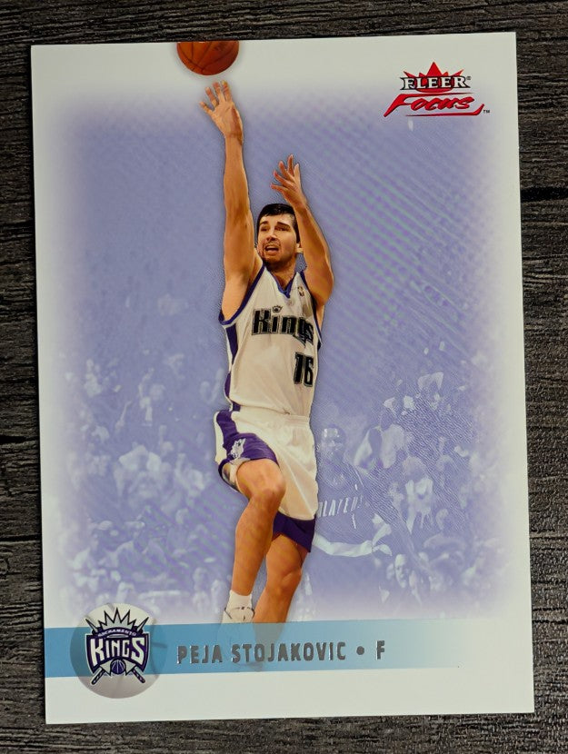 2003-04 Fleer Focus Numbers Century #106 Peja Stojakovic (EX)