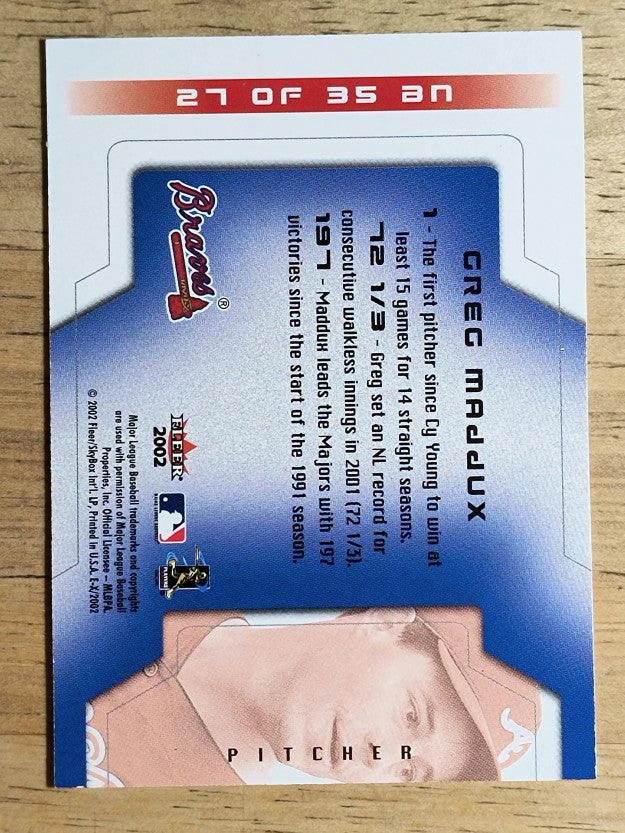 2002 E-X Behind the Numbers #27 Greg Maddux (NM)