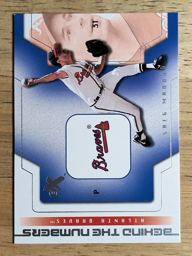 2002 E-X Behind the Numbers #27 Greg Maddux (NM)