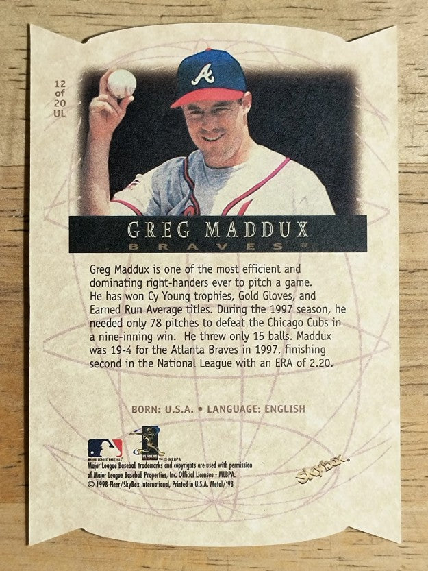 1998 Metal Universe Universal Language #12 Greg Maddux